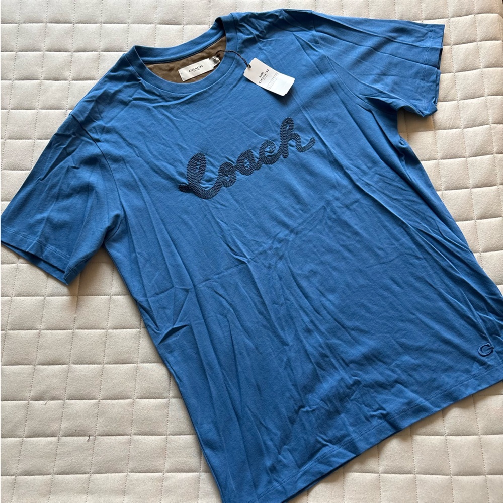 Coach Men’s Classic Blue Tee with Embroidered Coach Logo in Script